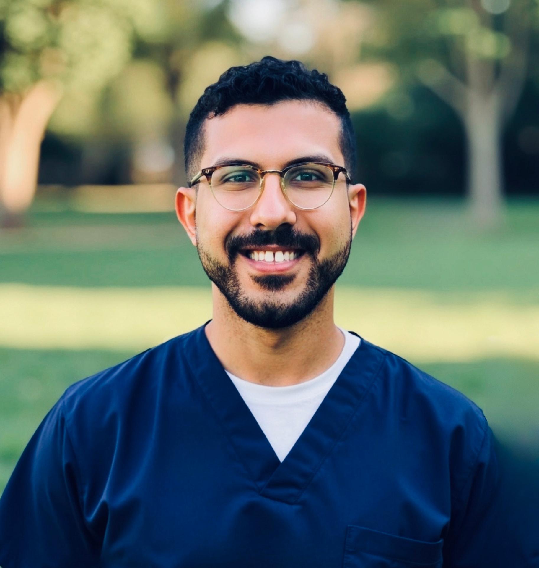 Amged Gad, PT, DPT, founder of Rezilient, in navy scrubs outdoors